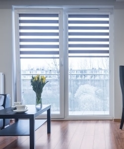 Image depicts new blinds installed on a vinyl window.