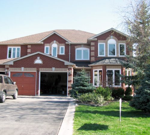 Image depicts a home with newly-installed casement windows.