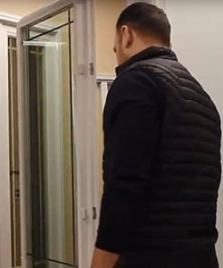 Image depicts NorthShield employee with a vinyl window.