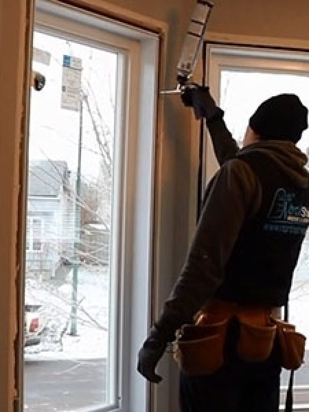 Image depicts NorthShield installers replacing a window.