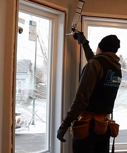 Image depicts NorthShield installers replacing a window.