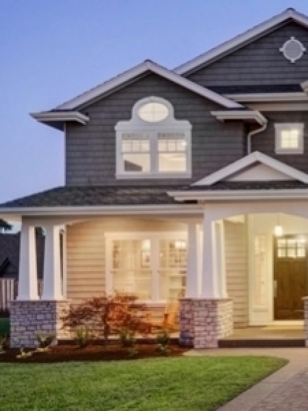 Image depicts a home wth new windows and a front door.