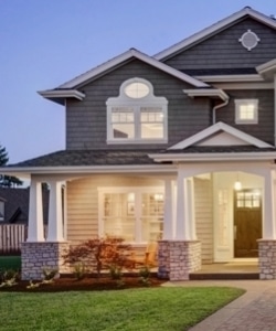 Image depicts a home wth new windows and a front door.