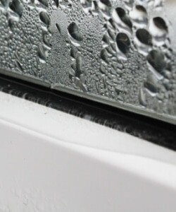 Image depicts rain on windows.