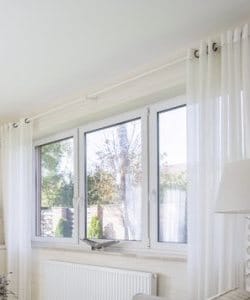 Image depicts three windows in a home.