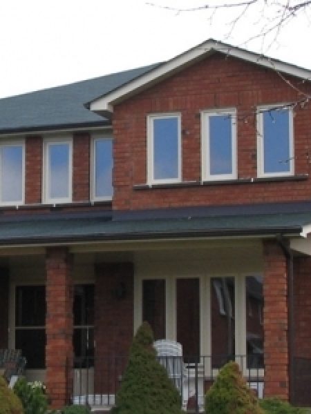 Image depicts a home with new vinyl windows.