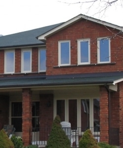 Image depicts a home with new vinyl windows.
