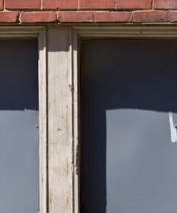 Image depicts an old window that neds to be replaced.