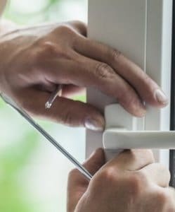 Image depicts someone replacing a window.