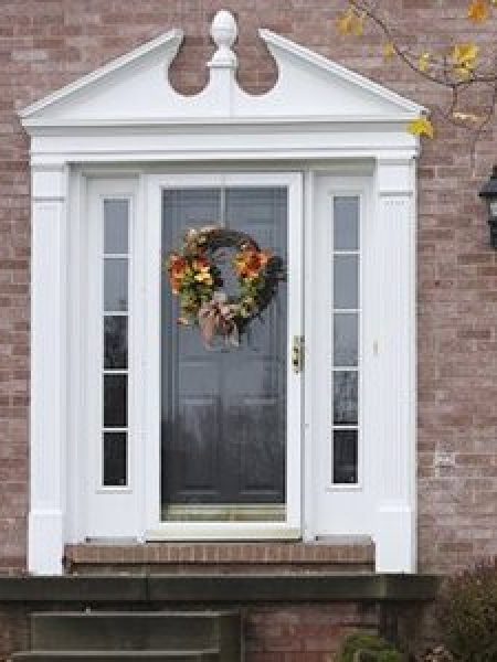 Image depicts a front door with a storm door.