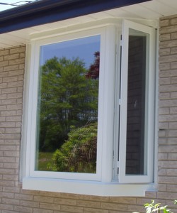 Image depicts a Winnipeg home with a bow window.