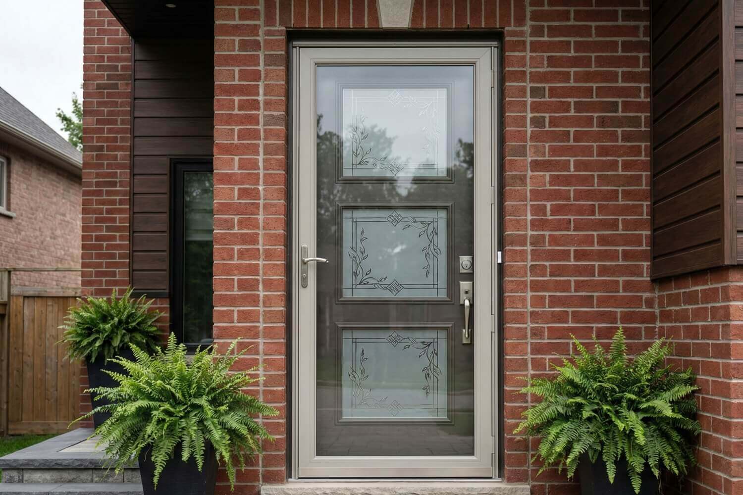 An elegant Tri-Lite door with decorative etched glass.