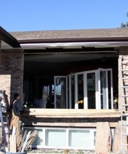 Image depicts NorthShield employees replacing windows.