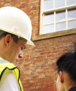 Image depicts NorthShield employee giving a client a free estimate.