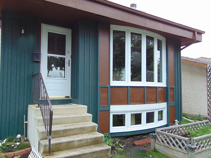 Image depicts a home with new bay windows.