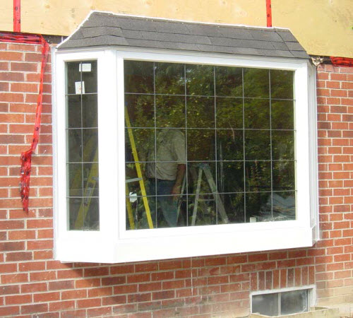 Image depicts a window with new grills.