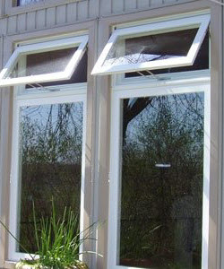 Image depicts two new vinyl windows installed in a home.
