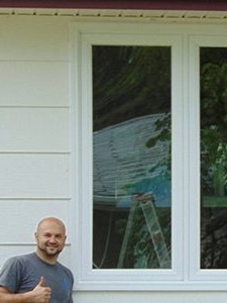 Image depicts a man with a newly replaced window.