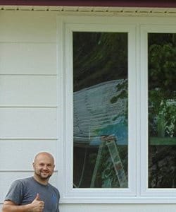Image depicts a man with a newly replaced window.