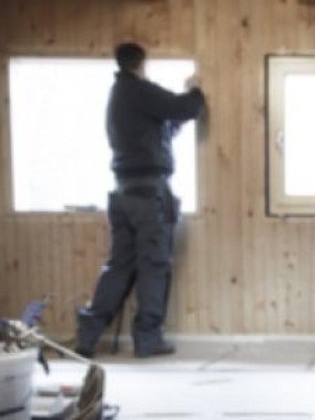 Image depicts NorthShield worker replacing vinyl windows.