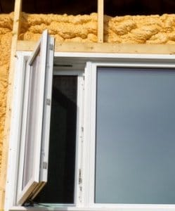 Image depicts a vinyl window that is being retrofitted.