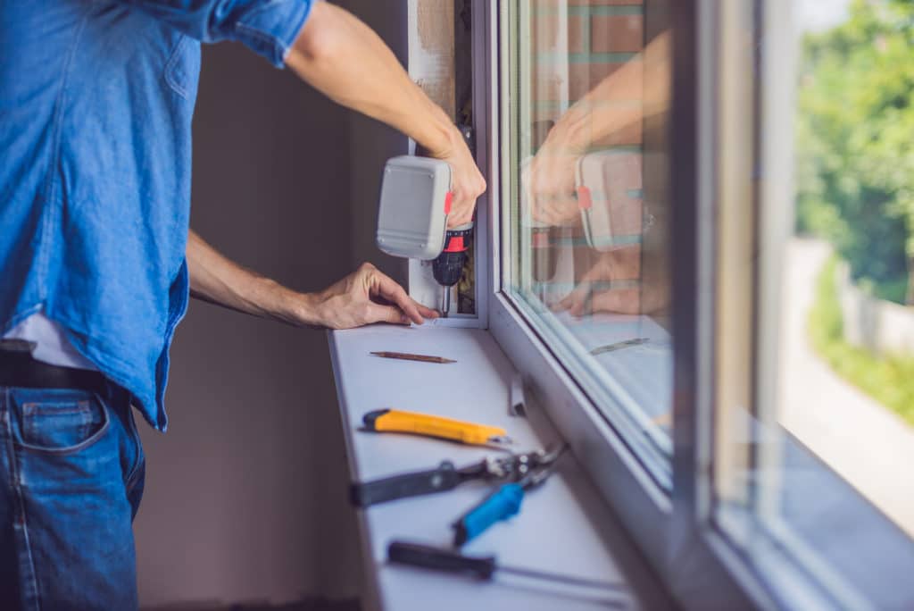 man doing window installation in winnipeg