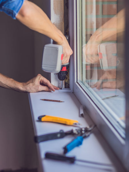 man doing window installation in winnipeg