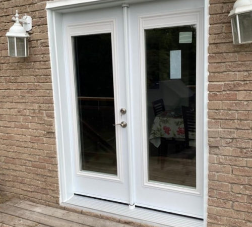 Black and white entry doors installation project in Thornhill.