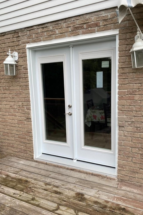 Black and white entry doors installation project in Thornhill.