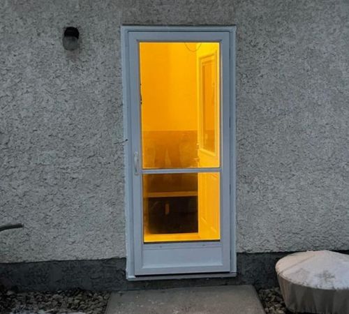 white entry door installation in Winnipeg