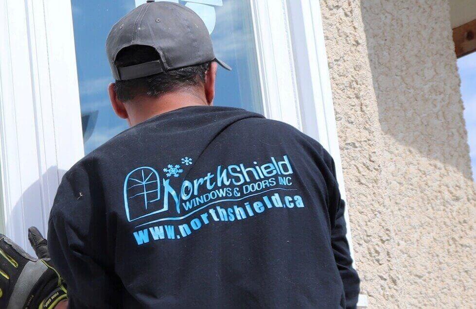 NorthShield Technician Holding New Window In Place For Installation In King City