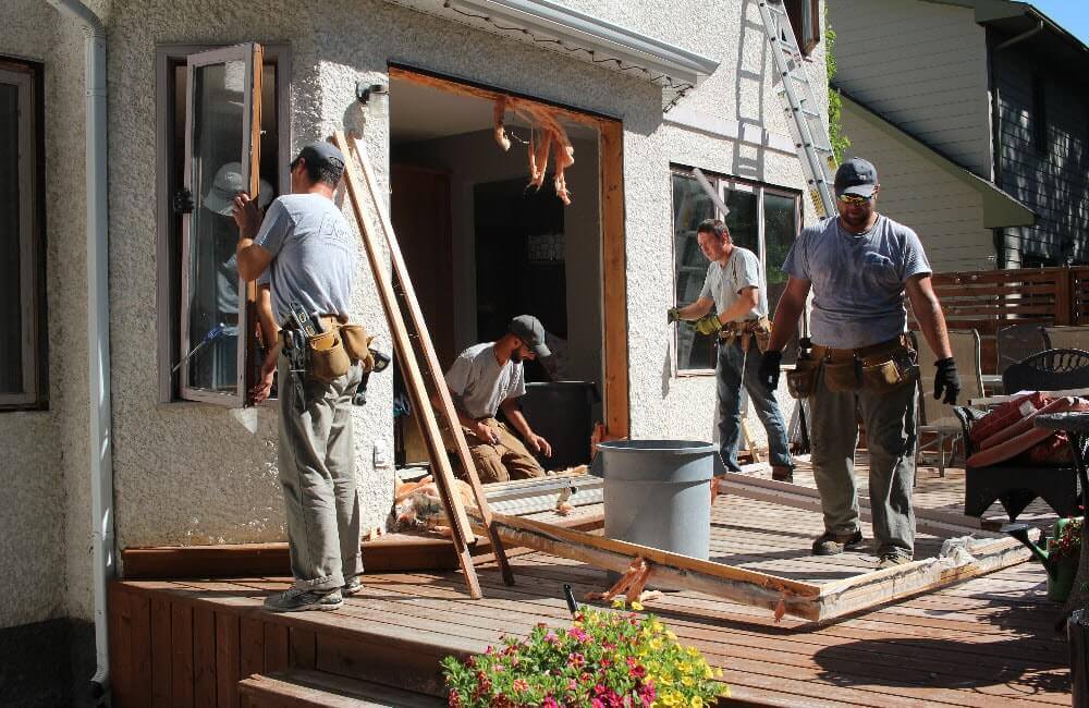 NorthShield Team Working Together To Replace Patio Doors in Caledon