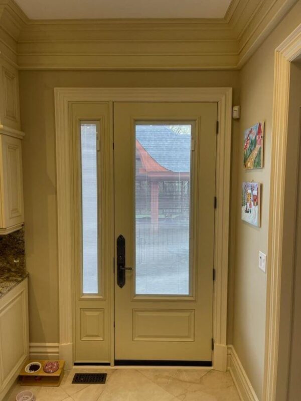 Beige fiberglass entry door with glass insert inside