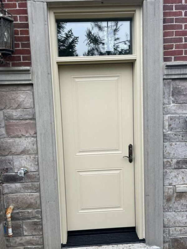 Beige fiberglass entry door with transom