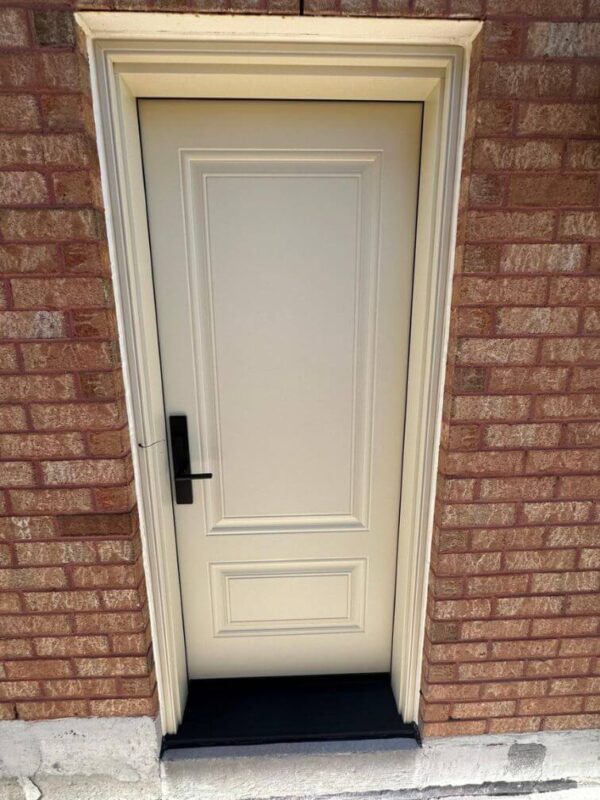 Beige steel entry door with black threshold