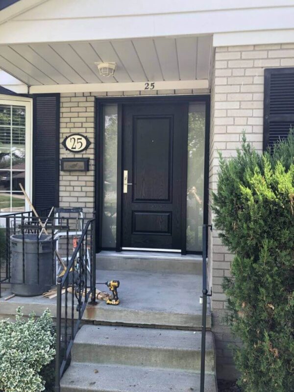 Black fiberglass entry door with frosted sidelights