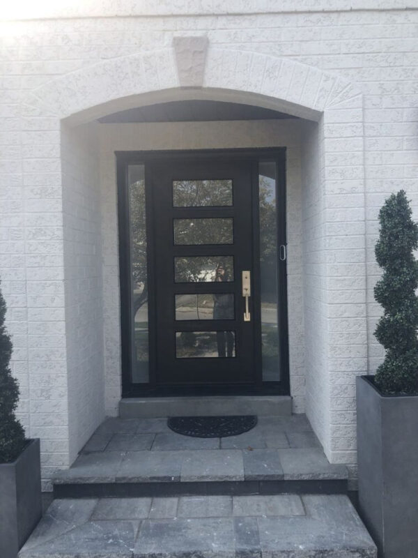 Black fiberglass entry door with glass inserts