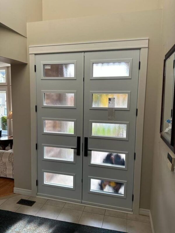 Black steel double entry door with multiple glass inserts inside