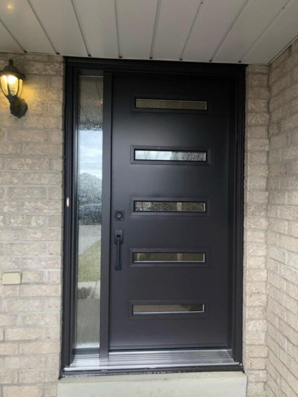 Black steel entry door with multiple glass inserts and sidelight