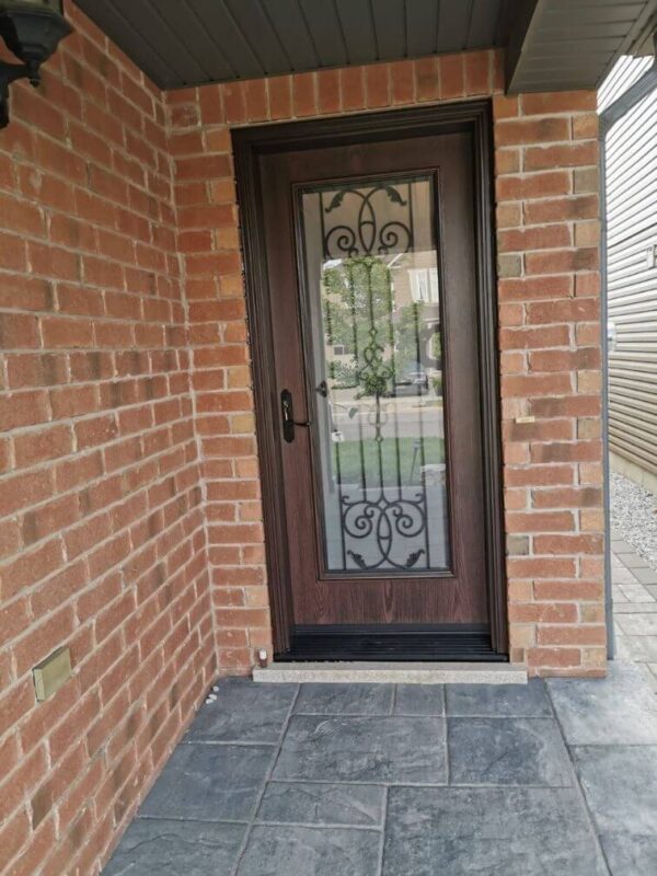 Brown fiberglass entry door with iron glass design