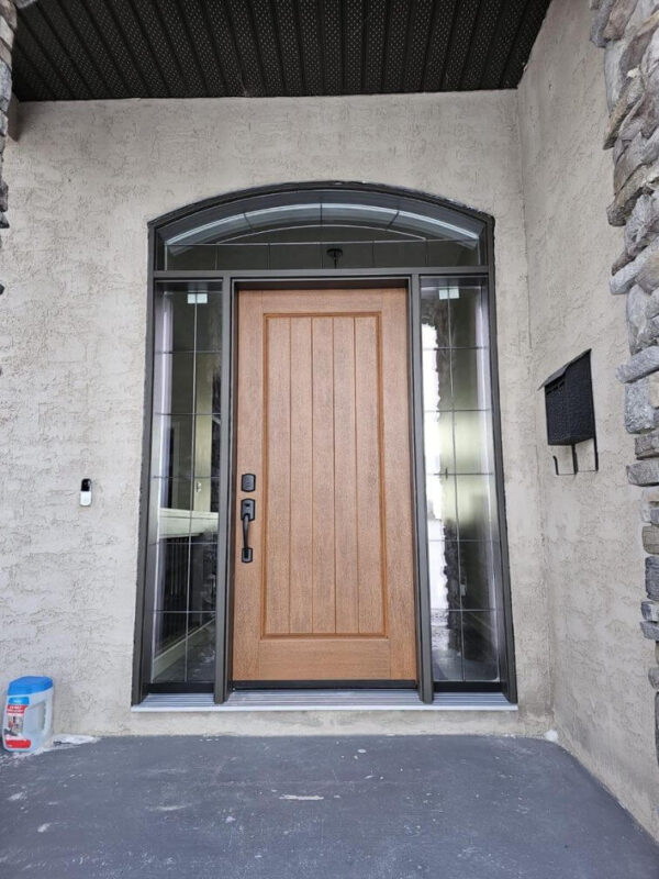 Brown fiberglass entry door with sidelights and transom