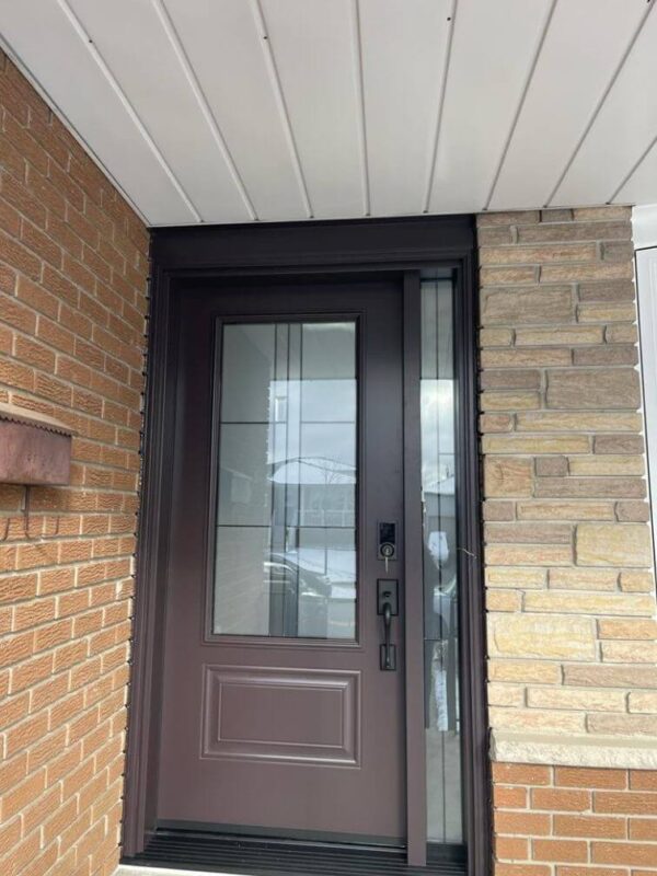 Brown steel entry door with glass insert and sidelight