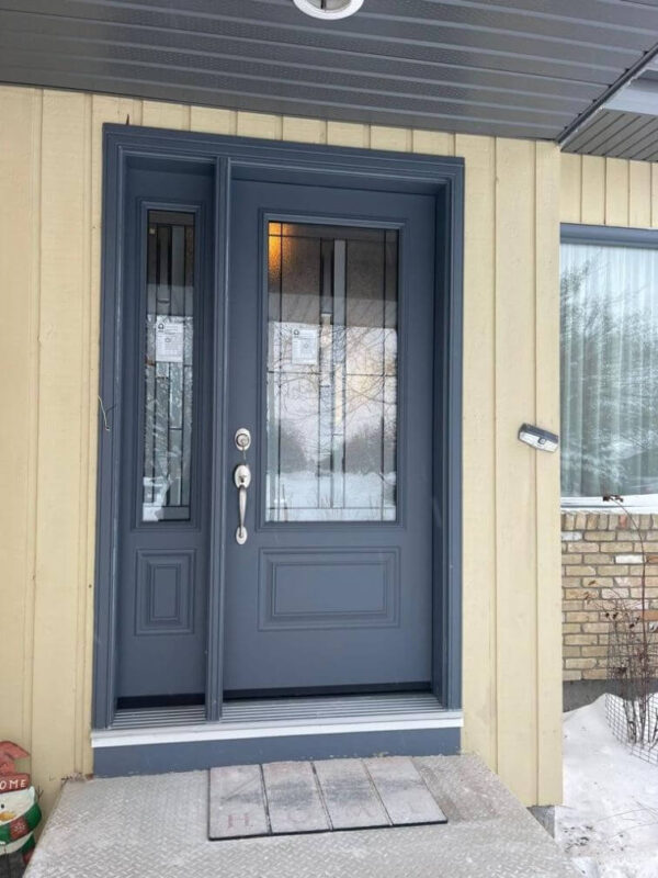 Grey steel entry door with glass insert and sidelight
