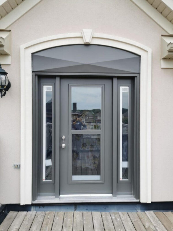 Grey steel entry door with sidelites and transom