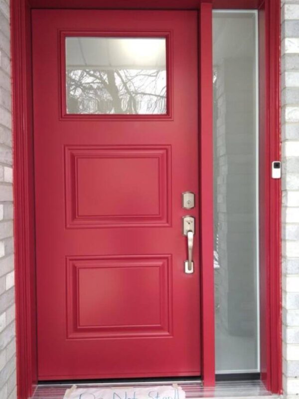 Red steel entry door with glass insert and sidelite