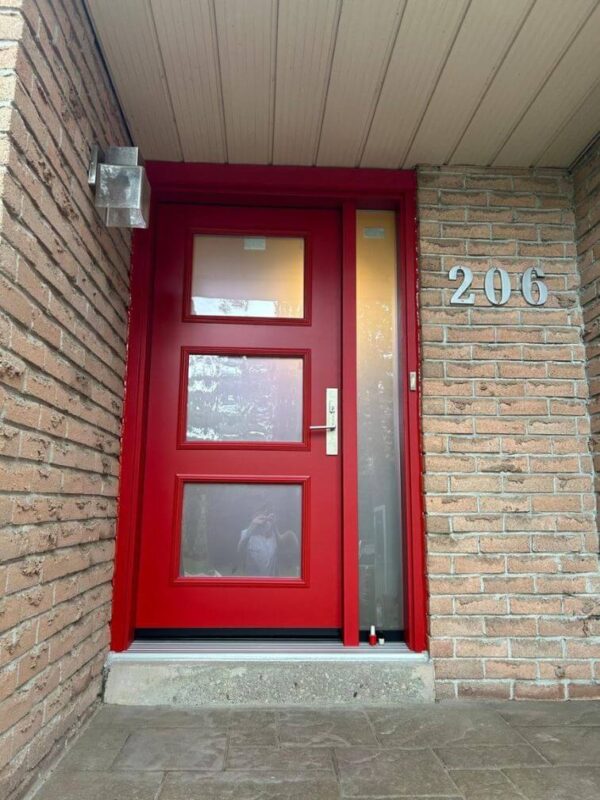 Red steel entry door with glass inserts and sidelite