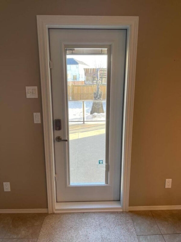White steel entry door with full glass insert inside