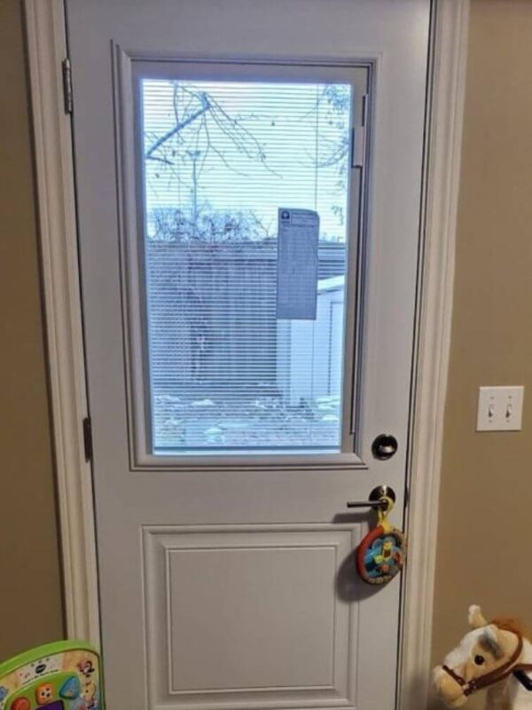 White steel entry door with glass insert inside
