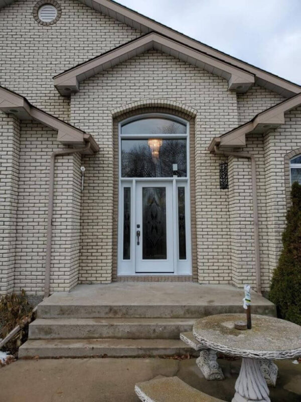 White steel entry door with sidelites and transom