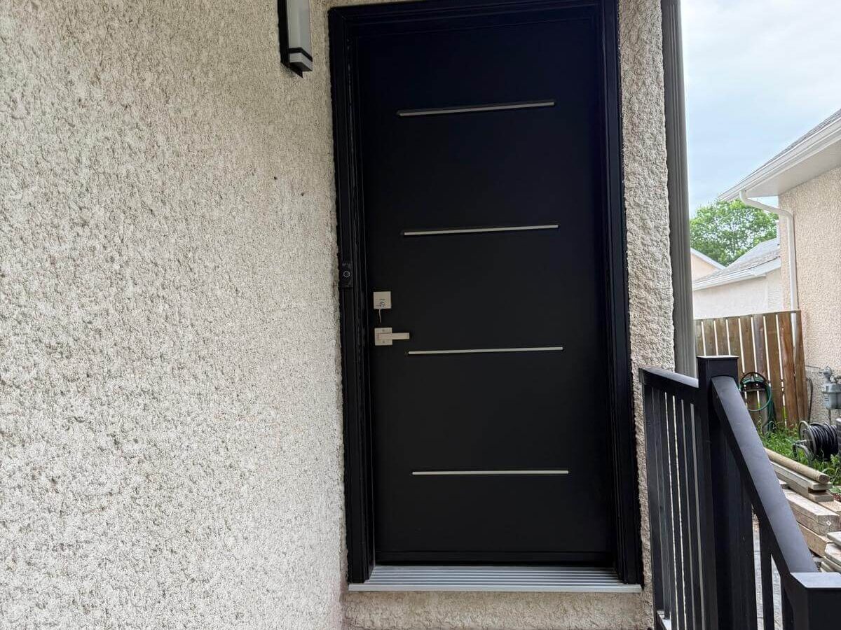 Black steel door with aluminum inserts Winnipeg